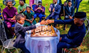 Ferdinand playing chess against Professor Yemi Osinbajo 